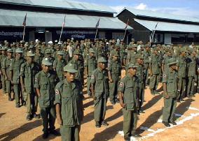 Cambodian soldiers turn in uniforms
